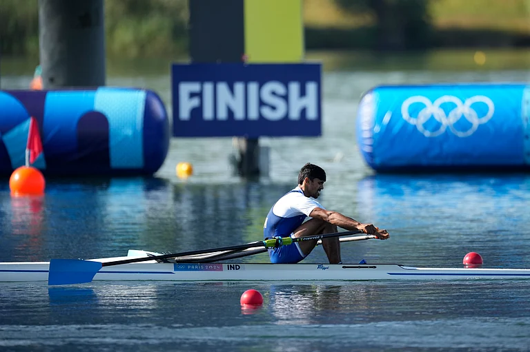 Balraj Panwar, of India, competes in the men's single scull rowing repechage at the 2024 Summer Olympics, Sunday, July 28, 2024, in Vaires-sur-Marne, France. - (AP Photo/Ebrahim Noroozi)